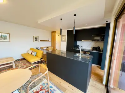a kitchen and living room with a counter top at Colours by Madeira Best Apartments in Funchal