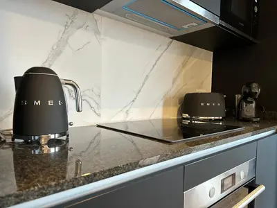 a kitchen with a coffee maker on a counter at Colours by Madeira Best Apartments in Funchal
