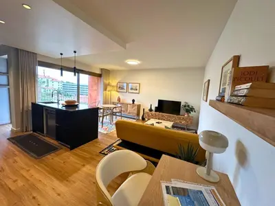 a living room with a couch and a table at Colours by Madeira Best Apartments in Funchal