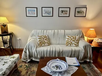a living room with a couch and a table at Casa da Avó - Vila do Porto in Vila do Porto