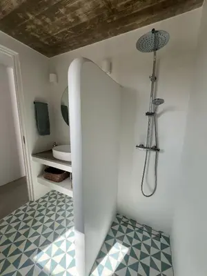 a white bathroom with a shower and a sink at Casa Fá - NEW T4 - Aljezur in Aljezur