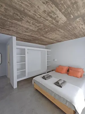 a bedroom with a bed with a wooden ceiling at Casa Fá - NEW T4 - Aljezur in Aljezur