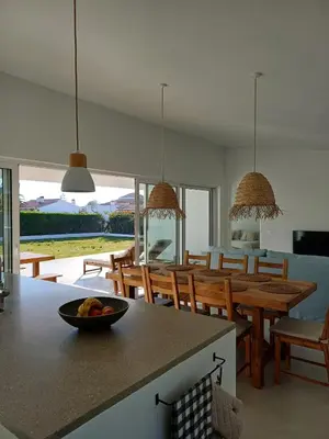a kitchen and dining room with a table and chairs at Casa Fá - NEW T4 - Aljezur in Aljezur
