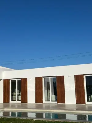 a rendering of a building with wood accents at Casa Fá - NEW T4 - Aljezur in Aljezur