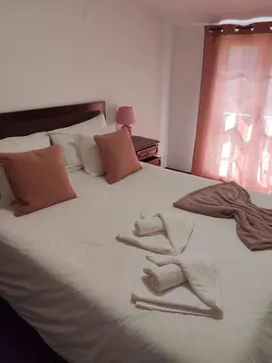a bathroom with a white sink and a shower at Refugio Catanho in São Vicente