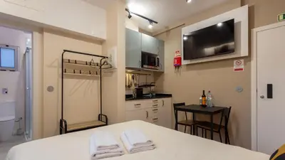 a kitchen with a table with two white towels at The Jolie - Porto Moniz Central Studios in Porto Moniz