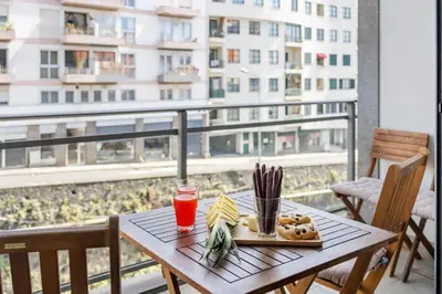 a table with a plate of food on a balcony at Madeira Emotions II, By OP in Funchal