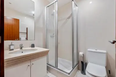 a bathroom with a shower and a toilet and a sink at Madeira Emotions II, By OP in Funchal