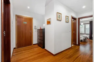 a room with white walls and a wooden door at Madeira Emotions II, By OP in Funchal