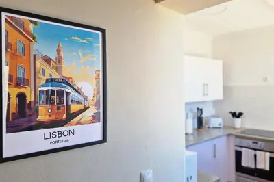 a painting of a train on a wall in a kitchen at Desertas Vista Ninho by LovelyStay in Gaula