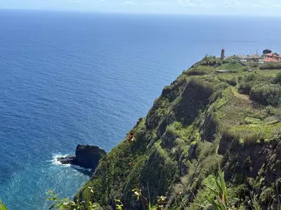 a view of the ocean from a cliff at Casa do Farol Guest House in São Jorge