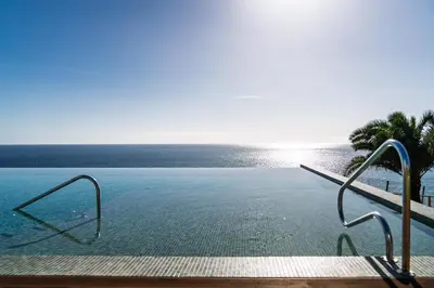a swimming pool with a view of the ocean at With pool and sea view - Acqua Residence III in Funchal