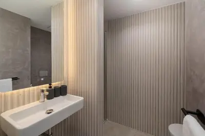 a bathroom with a sink and a mirror at With pool and sea view - Acqua Residence III in Funchal