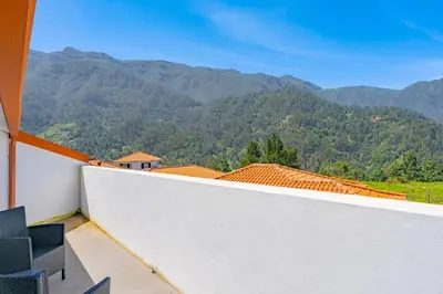 a balcony with a view of mountains at Casa Vale da Laurissilva in São Vicente