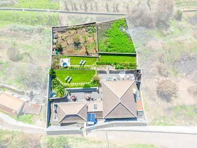 an overhead view of a house with a yard at NEW! Nature Paradise with Ocean View & Hot Tubs in Fajã da Ovelha