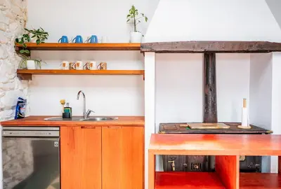 a small kitchen with a sink and a stove at NEW! Nature Paradise with Ocean View & Hot Tubs in Fajã da Ovelha