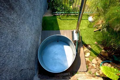 a bath tub sitting in the backyard of a house at NEW! Nature Paradise with Ocean View & Hot Tubs in Fajã da Ovelha
