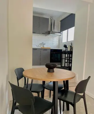 a dining room table and chairs in a kitchen at Casa da Vila in Machico