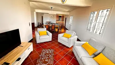 a room with a dresser and a mirror at Casa Mollivia - Breath taking views over Funchal in Funchal