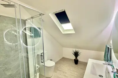 a bathroom with a shower and a toilet and a sink at Anna-Marie House in Ponta do Sol