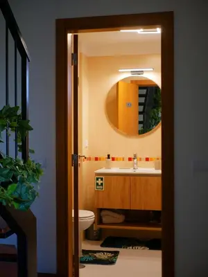 a bathroom with a sink and a mirror at A SELVA T2 in Caniço in Caniço