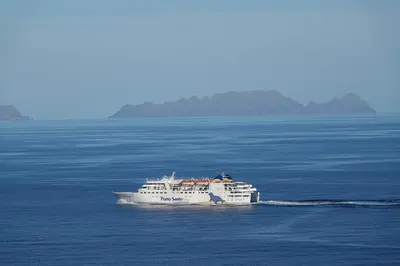 a white boat in the middle of the ocean at Aylevarroo Penthouse in Caniço
