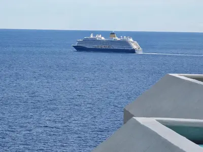 a large cruise ship in the ocean with at Aylevarroo Penthouse in Caniço