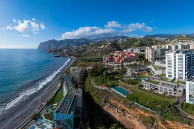 an aerial view of the beach and buildings at With pool in Funchal - Acqua Residence V in Funchal