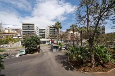 a parking lot in a city with tall buildings at With pool in Funchal - Acqua Residence V in Funchal