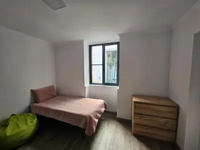 a small room with a bed and a window at Bela Vista House in Funchal