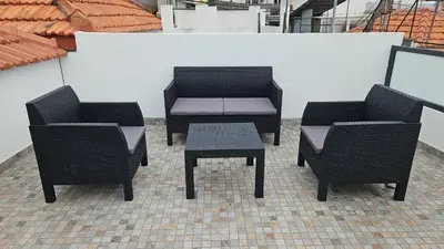 a group of chairs and a table and a bench at Bela Vista House in Funchal