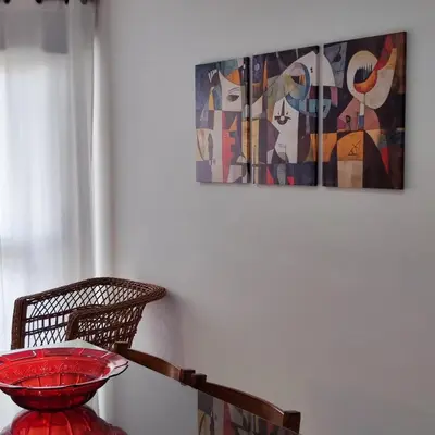 a bowl on a table with a painting on the wall at Sol I in Funchal