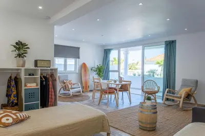 a living room with a table and chairs at CoWorking and CoLiving Villa in Sagres