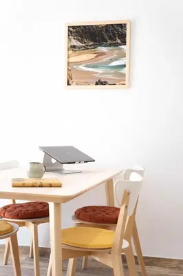 a table and chairs with a laptop on top of it at CoWorking and CoLiving Villa in Sagres