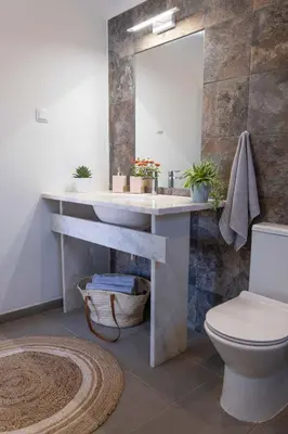 a bathroom with a sink and a toilet at CoWorking and CoLiving Villa in Sagres