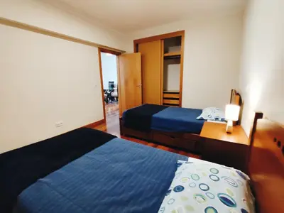 a hotel room with two beds and a window at Coastal Comfort at Riverside - 4 Min to Airport! in Santa Cruz