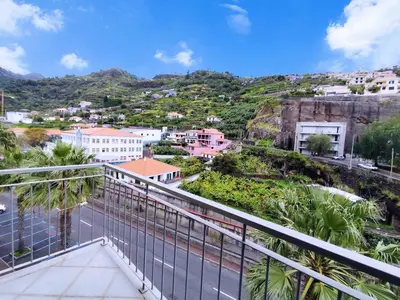 a view of a city from a balcony at Coastal Comfort at Riverside - 4 Min to Airport! in Santa Cruz