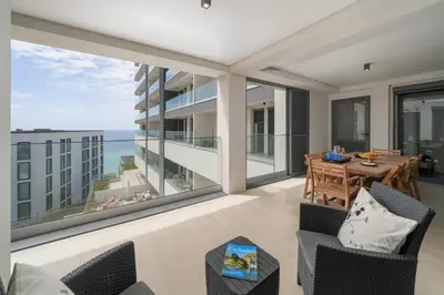 an apartment balcony with a view of the ocean at Acqua Residence VII - Luxury 3BR in Funchal in Funchal
