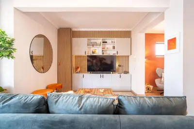 a living room with a blue couch at Magnolia Terrace by Amazing Madeira in Funchal
