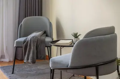 two chairs and a table in a room at SUPER Rabbit in Funchal