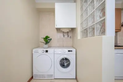 a laundry room with a washer and dryer at SUPER Rabbit in Funchal