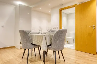 a dining room with a table and chairs at Casa do Pinheiro II, a Home in Madeira in São Vicente