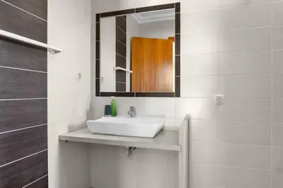 a bathroom with a sink and a mirror at L40 Villa & Pool- Vale da Telha, Aljezur in Aljezur