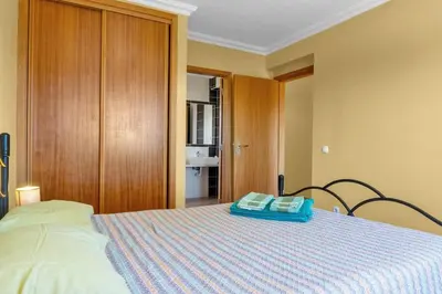 a bedroom with a bed with two pillows on it at L40 Villa & Pool- Vale da Telha, Aljezur in Aljezur
