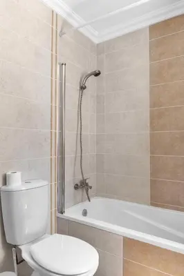 a bathroom with a toilet and a bath tub at L40 Villa & Pool- Vale da Telha, Aljezur in Aljezur
