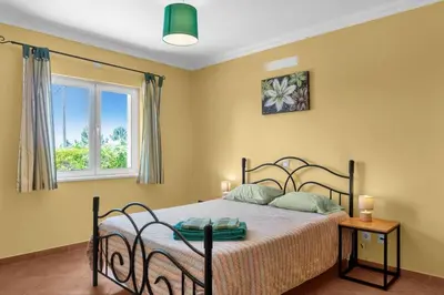 a bedroom with a bed and a window at L40 Villa & Pool- Vale da Telha, Aljezur in Aljezur