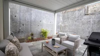 a living room with a couch and a table at CasaNova by LovelyStay in Santa Cruz