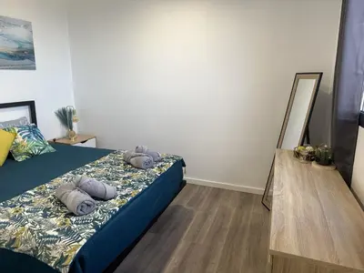 a mirror and a dresser in a room with a window at Pearl Of The Sea in Ponta do Sol