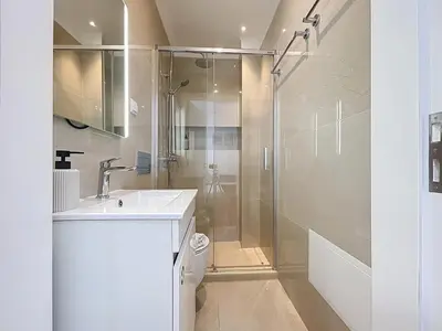a bathroom with a sink and a shower at CityZen Funchal by Atlantic Holiday in Funchal