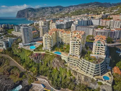 an aerial view of a city with buildings and the ocean at Urso Tigre Apartment by Holiday Rental Madeira in Funchal